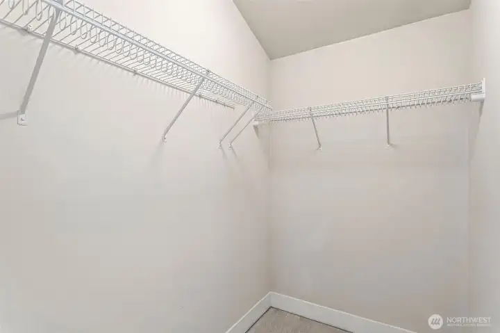 Large walk-in closet for primary bedroom.