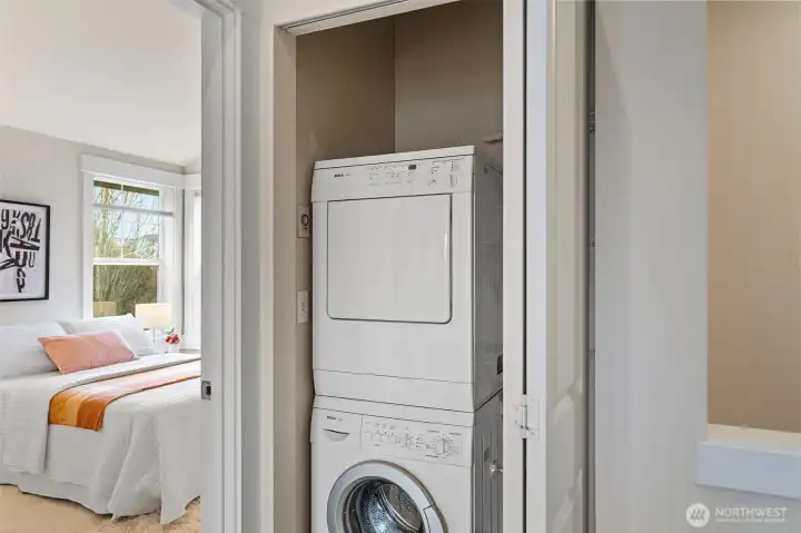 Laundry is conveniently located on the upper floor, featuring a Bosch Axxis Stackable washer-dryer and          extra storage space.