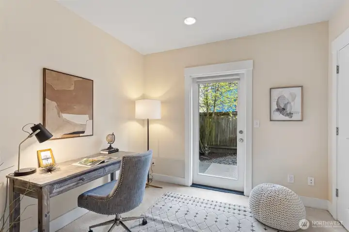 On the entry level a third bedroom with direct access to the fully enclosed backyard—perfect for guests, work-from-home space, or flex living.