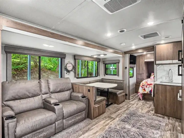 Spacious main living area with recliner seating and dinette—comfortable and functional layout