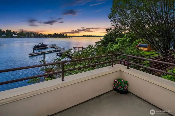 Step from the dining room onto an intimate uncovered 2nd deck that flows to the beautifully landscaped lawn and on to your private, gated dock. Morning coffee, evening sunsets, spontaneous afternoons on the water — it's all right here.