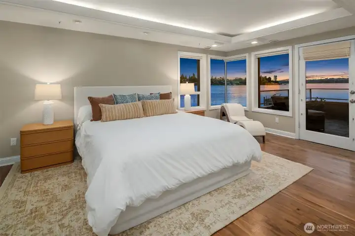 Wake to the soft light of morning over Yarrow Bay, or drift to sleep with the last colors of sunset reflected on the water. The primary bedroom is a sanctuary in the truest sense — warm hardwood floors, a generous layout, and a front-row view of Lake Washington that makes every evening feel like an escape.