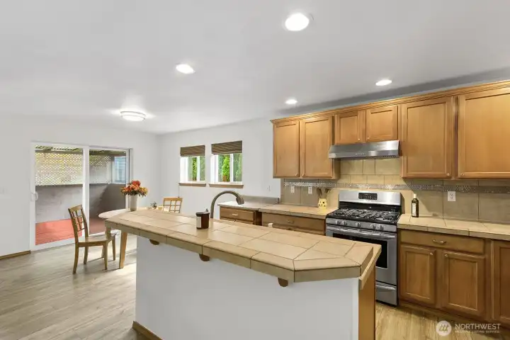 Kitchen and dining room lead out to covered patio.