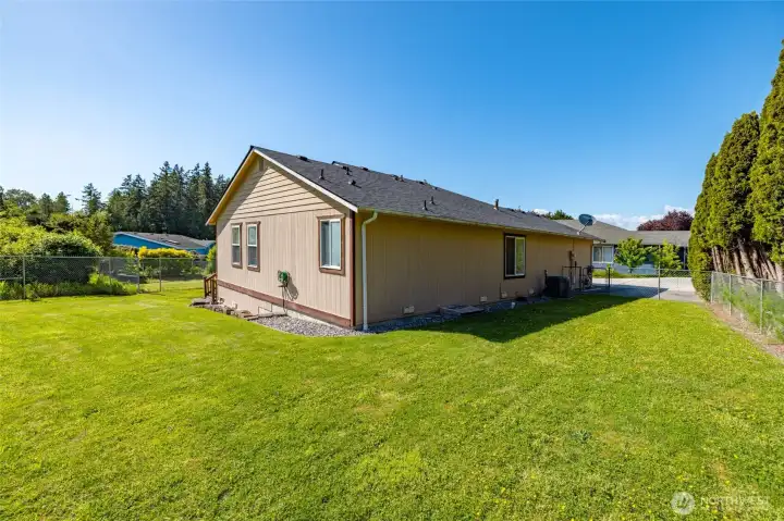 This .20/acre level lot offers plenty of room for everything - great southern exposure for gardening, or just enjoying the sun.  Extra parking pad next to the garage.  Heat pump for AC.