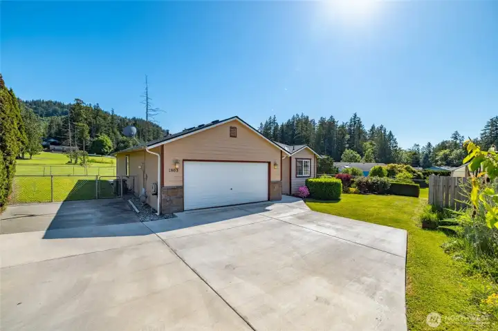 Attached 2 car garage, plus additional parking pad next to the garage.