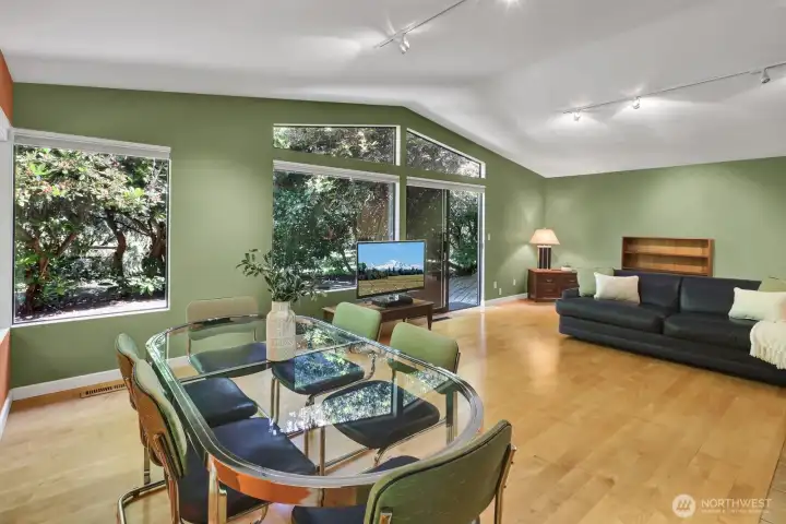 Living room with formal dining area, or just a large living room. The trees and rhododendrons provides privacy. Living room with formal dining area, or just a large living room. The trees and rhododendrons provides privacy.