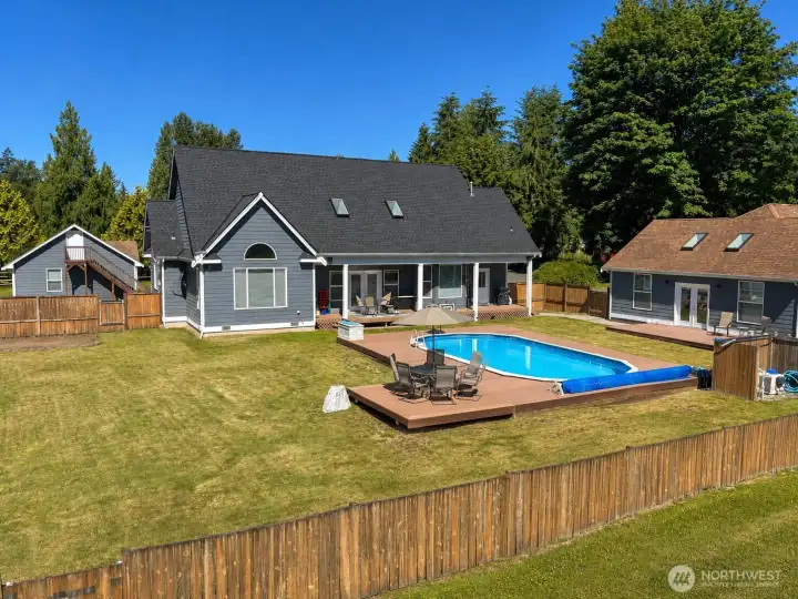 Huge covered deck off of home, ADU to the right, great place to entertain. Huge covered deck off of home, ADU to the right, great place to entertain.