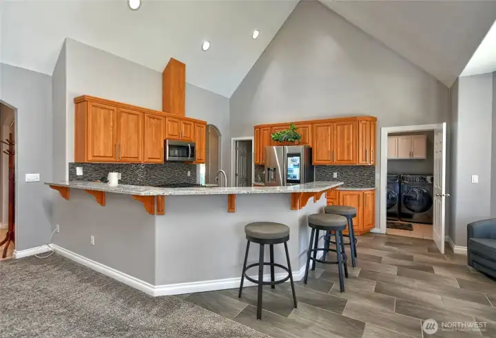 Check out all the sitting around the bar of the kitchen, laundry room to the right. Check out all the sitting around the bar of the kitchen, laundry room to the right.