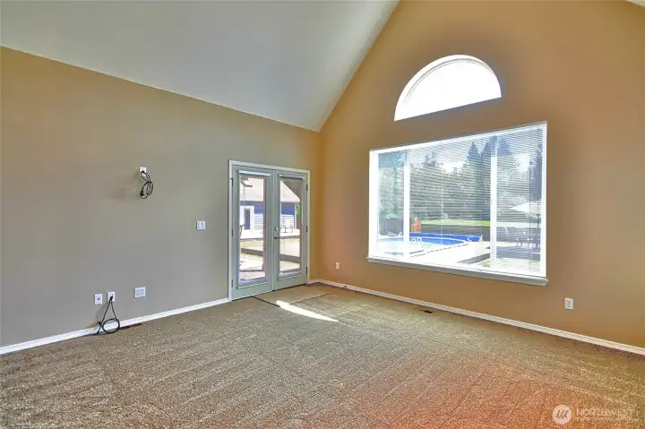 Primary bedroom doors lead to back deck Primary bedroom doors lead to back deck