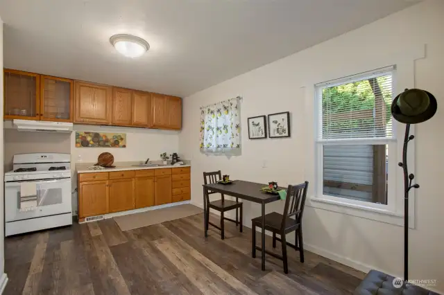 Open kitchen with lots of natural lighting and counter space. Enjoy cooking on the gas stove.