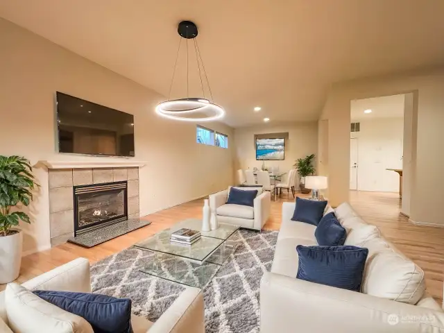 Family room with fireplace open to dining space