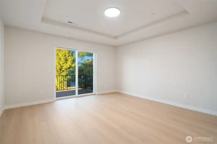 Primary bedroom with balcony