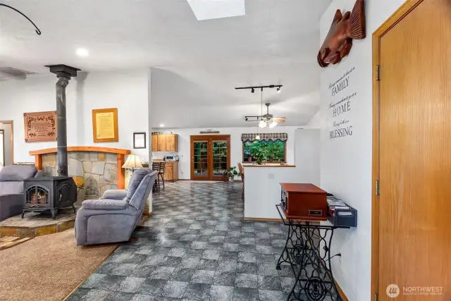 Living room with decor' fireplace for cooler days and to offset heat bills