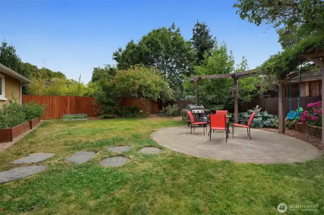 Relax on the circular patio amidst the beautiful planting.