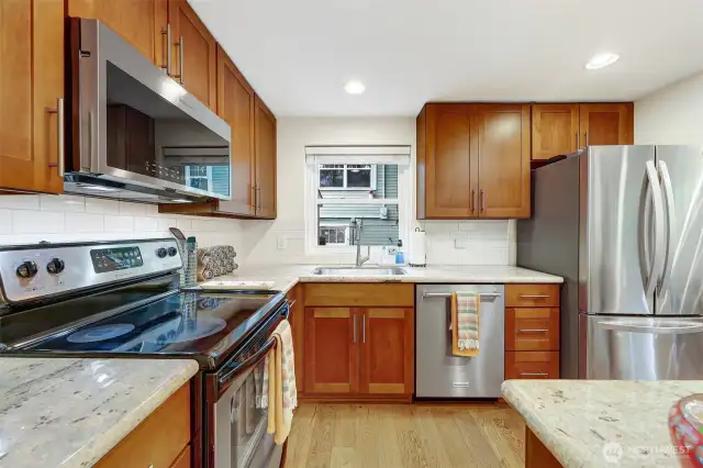 Updated kitchen. Note the wide plank hardwood floors too.