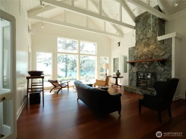 Light-filled living room with grand fireplace