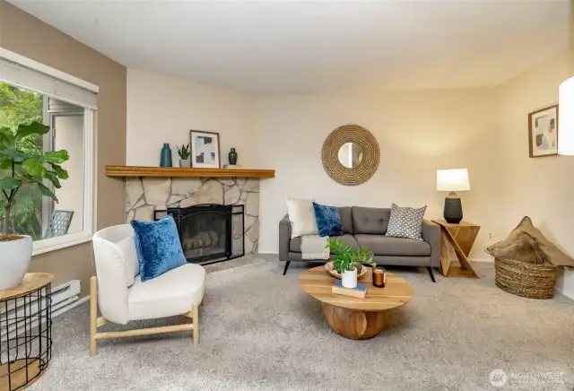 Inviting living room area with wood fireplace