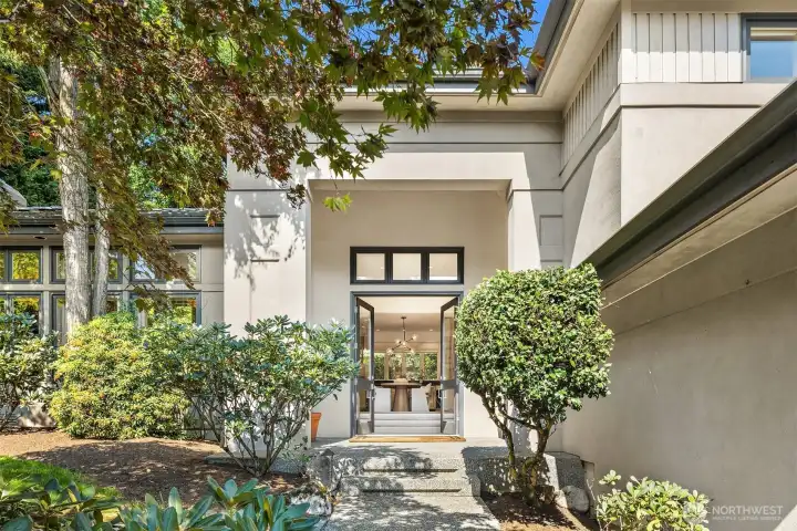 Soaring entry & ceilings on a sun soaked lot