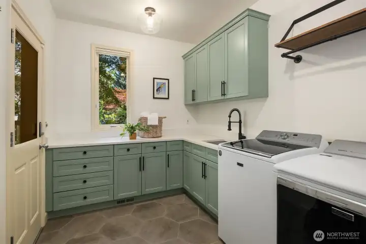 Remodeled in 2021 with painted cabinets, new tile floor & quartz countertop. Separate entrance exterior door to the side of the house plus storage closet & Maytag washer & dryer.