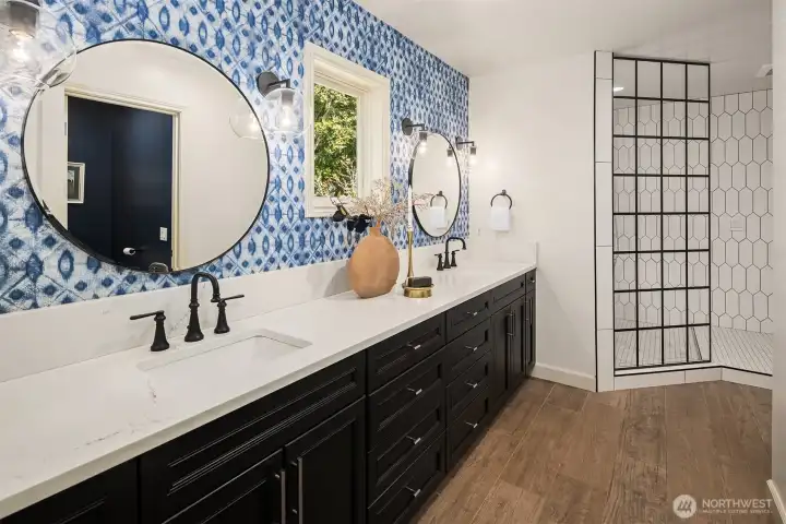 Updated bathroom with quartz countertop, new fixtures, dual sinks & oversized, walk-in shower. Plus large walk-in closet with organization system. Updated in 2021 with new flooring, paint & lighting.