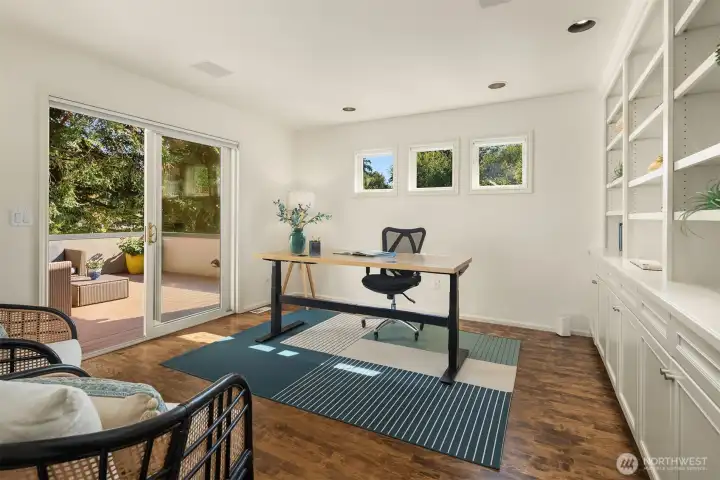 Large office with glass sliding door out to sunny, private deck. Trex Composite installed in 2022.