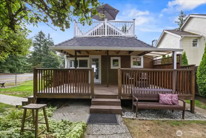 Large covered deck with balcony above