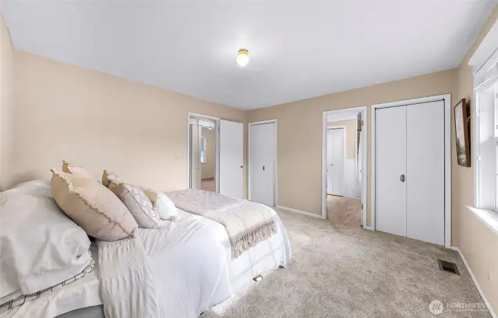 Primary Bedroom features 3 separate closets, including an extra large walk in storage room