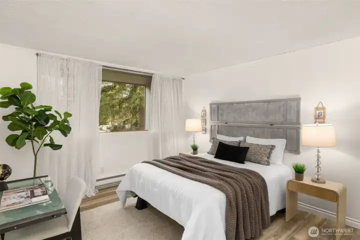 Step into this large bedroom with updated windows and Luxury Vinyl Plank flooring. This is on the first floor, entry level of the unit.