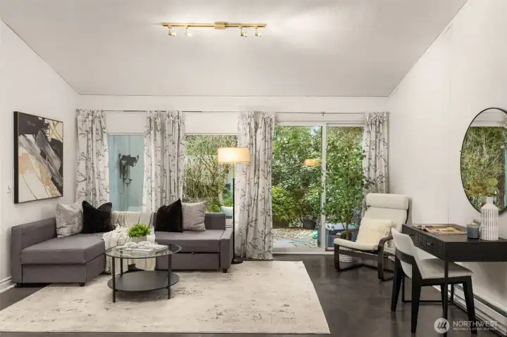 This lower level of home is multi functional. Offers a stunning living room option, as well as your very own home office functionality. Easy to manage and clean, gloss cement finished floors.