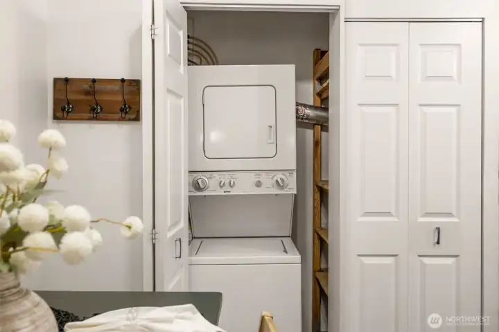 These great bi-fold door closets house the Hot Water Heater, stackable Washer/Dryer, and it is where the large Kitchen pantry is located