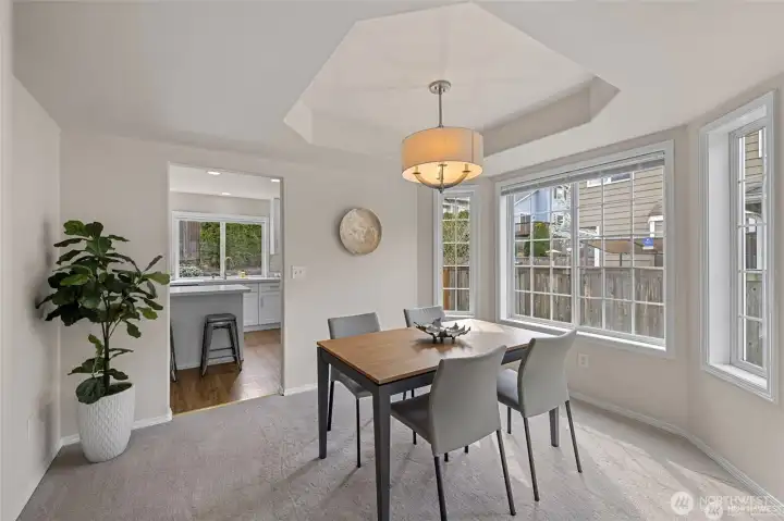 Step into a dining room where architectural detail meets effortless light. The centerpiece of this space is a stunning cove ceiling, adding a layer of sophisticated depth and character that elevates every meal into an occasion.  ?Bathed in shimmering natural light, this room offers a refined yet airy atmosphere for hosting everything from intimate holiday dinners to vibrant Sunday brunches. It’s a space that feels both distinct and perfectly integrated, providing a polished backdrop that truly shines.