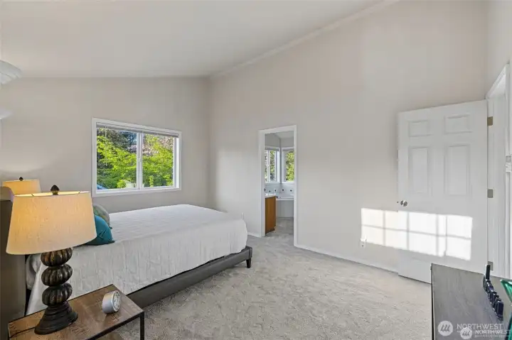 A Private Sanctuary: The Primary Suite  ?Retreat to a primary suite that feels more like a personal oasis. The grand scale of the room is immediately elevated by vaulted ceilings, creating an airy, peaceful retreat at the end of a long day.  ?The experience continues in the private ensuite, where you can unwind in the oversized soaking tub or enjoy the convenience of a sleek dual-sink vanity. Complete with a massive walk-in closet that offers ample space for every season, this suite is the perfect blend of architectural beauty and everyday luxury.