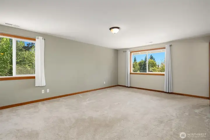 Primary bedroom, with walk in closet (not shown) and ensuite