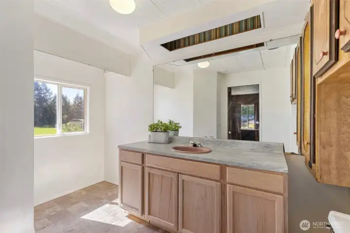 A shower can be added to make this a full bathroom