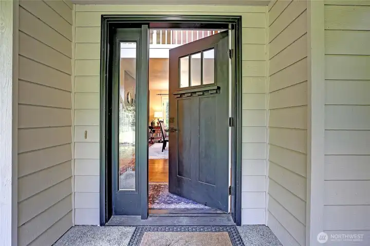 The welcoming front door opens to a home filled with comfort and charm.