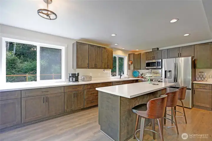 Spacious kitchen with abundant cabinetry, ample counter space, and a bright eating area for everyday dining.