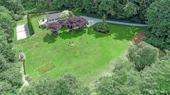 Aerial imagery showcases the home's thoughtful layout, mature landscaping, and generous outdoor space.
