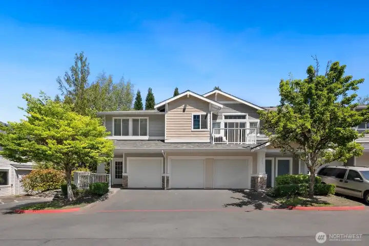The attached garage (middle) has direct access to the condo.