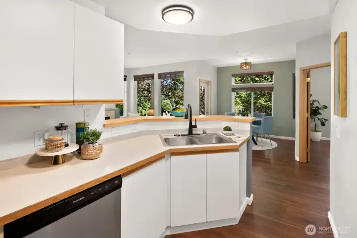 Kitchen open to living and dining spaces.