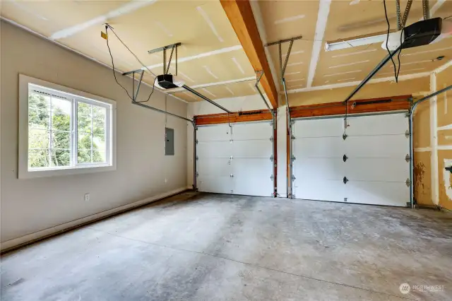 Spacious and well-lit attached 2-car Garage.
