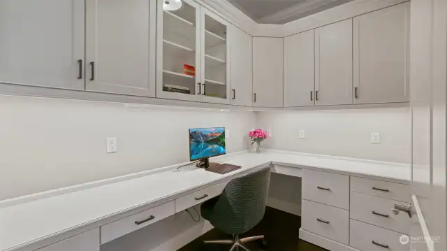 Second office tucked behind the kitchen with beautiful built-ins