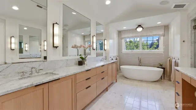 Carrera marble counters, heated floors, custom cabinetry - no luxury is spared in this incredible bathroom!