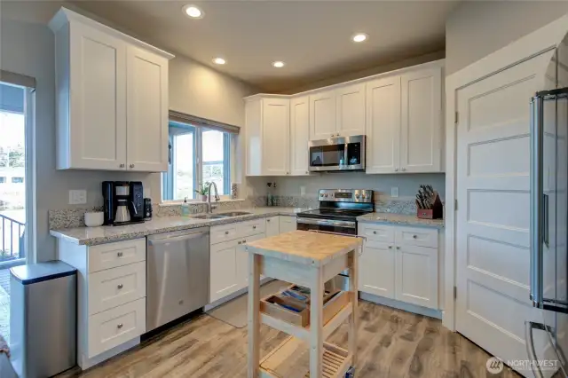 Beautiful kitchen with stainless steel appliances and granite countertops.