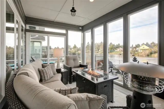 The sunroom opens out on the North end to the open deck with sun lounges.