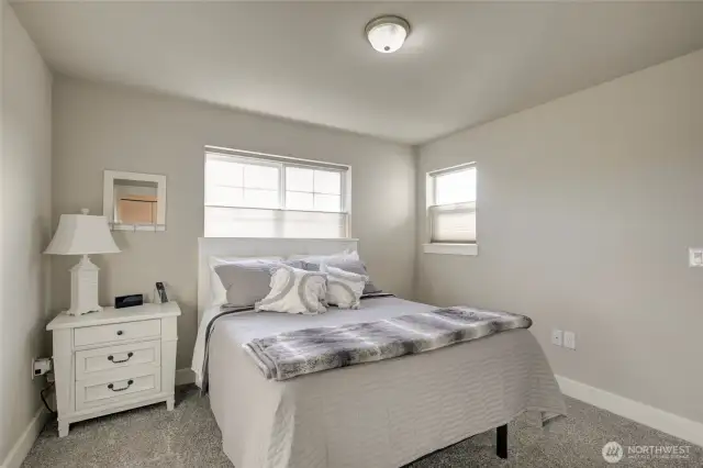 Across the hall is another spacious bedroom.