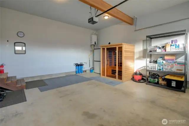 A quick peek inside the garage.  Plenty of storage, on demand hot water, and a whole home water filtration system!