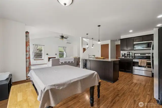 From dining to kitchen to living room, this shot gives you a peek at the effortless flow between spaces. The low-profile lighting in the dining room gives you flexibility for any setup, while the open layout ensures the home feels connected and airy.