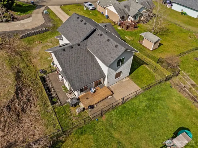 This aerial shot gives you the full picture: fenced backyard privacy, plenty of elbow room, and the peace of mind that comes with a newer 2017 build. The roof? Basically, still the early years. The systems? Still living their best life.