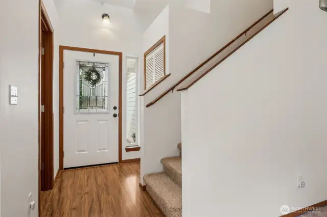 A tall, vaulted ceiling makes a grand first impression, and the leaded glass window in the front door brings just the right amount of sparkle. With a coat closet tucked behind louvered doors and quick access to the powder room, this entry is more than just good looks, it’s functional, too.