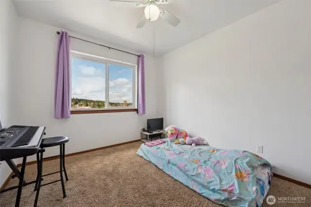 Ready for sweet dreams in the third bedroom? It’s got the same comfy brown carpet, a ceiling fan to keep the air moving, and a large window for lots of natural light. With 1,607 sq. ft. of space, this home has room to spare, plus forced air heating to keep you cozy, all in a house built in 2017. It’s as fresh as it looks.